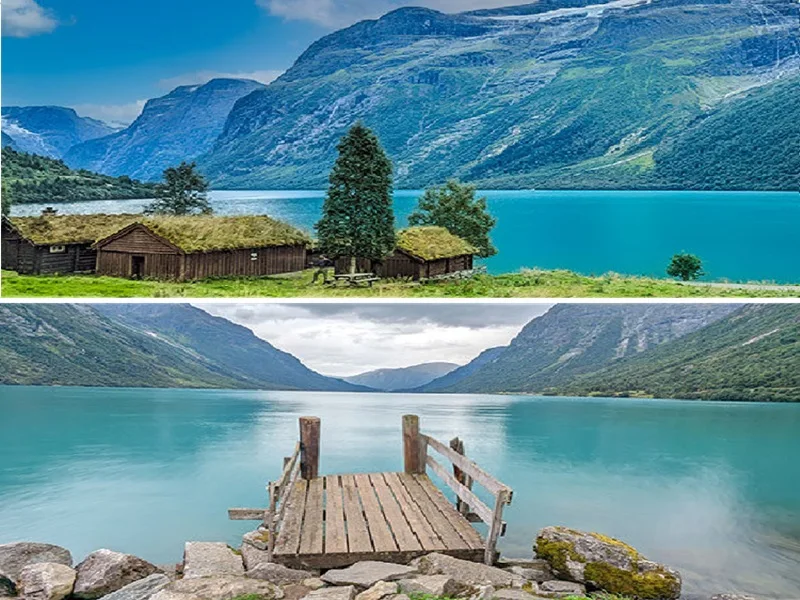 Traditional wooden houses with grass roofs beside a turquoise lake in Norway, with green mountains behind.
