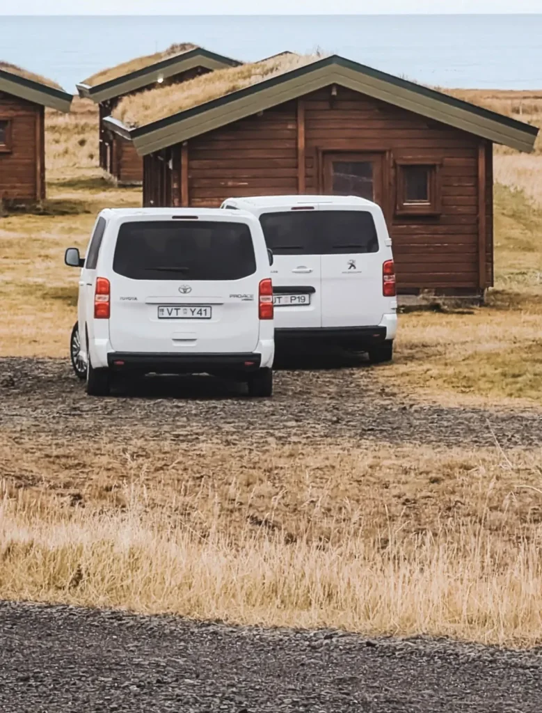 Our two vans outside the wooden cabins